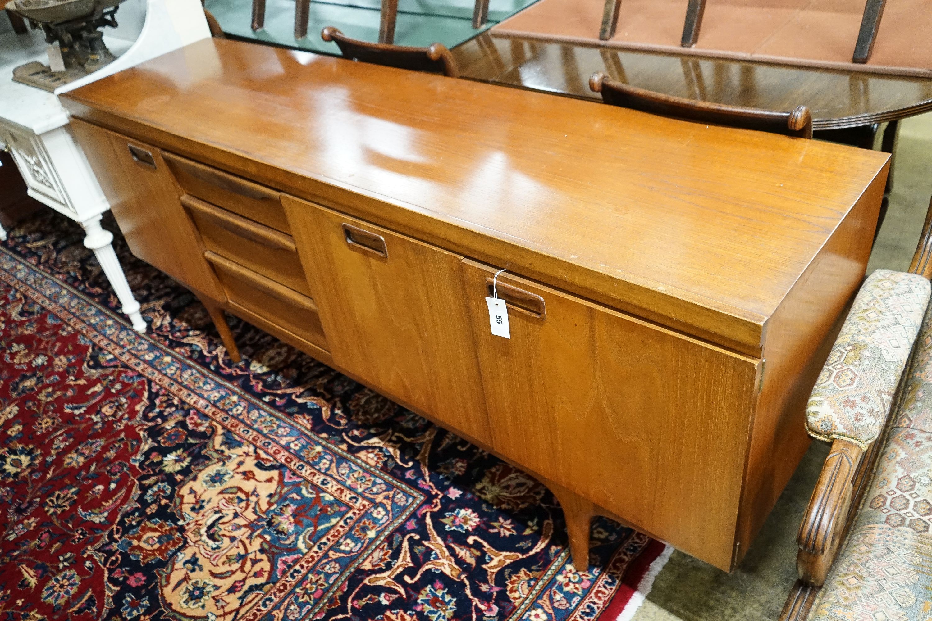 A mid 20th century design teak sideboard, by Greaves and Thomas, length 176cm, depth 45cm, height 77cm